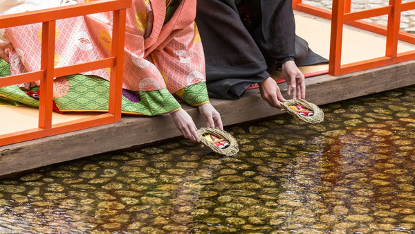 Nagashibina, a traditional ritual to ward off evil spirits by sending human-shaped dolls, typically made of paper or straw, down the river.