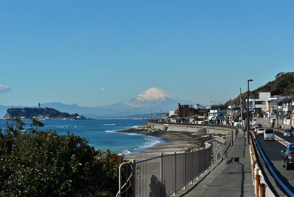 The present view of Mount Fuji from Inamuragasaki with Enoshima in the foreground. | © PhotoAC